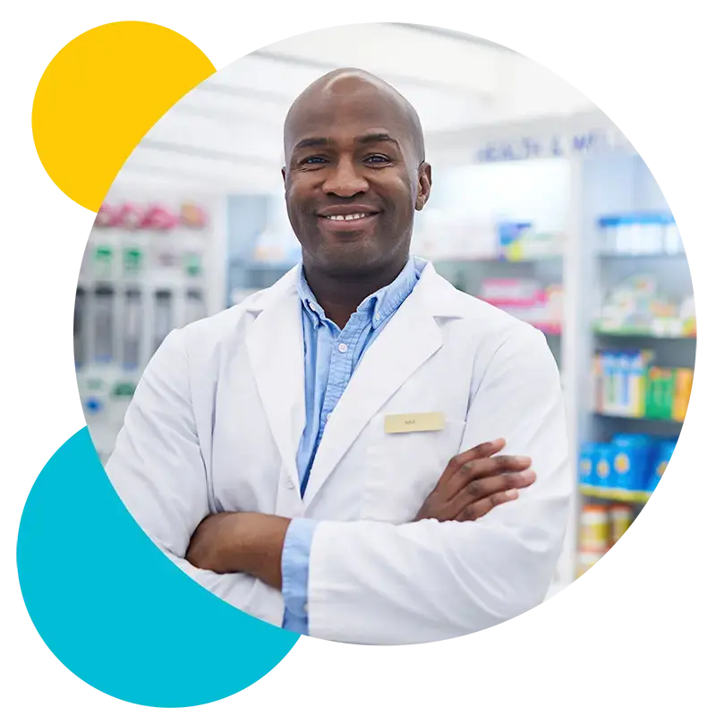 Smiling pharmacist with arms crossed